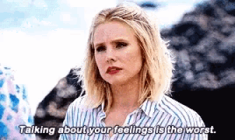 a woman is talking about her feelings in a striped shirt .