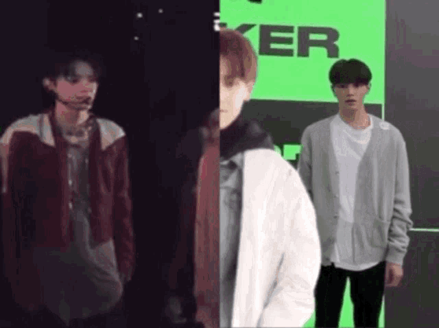 two young men are standing next to each other in front of a green wall .