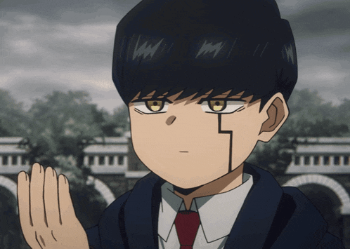 a young boy in a suit and tie with a black stripe on his face