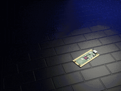 a small piece of electronic equipment is laying on a black tile floor