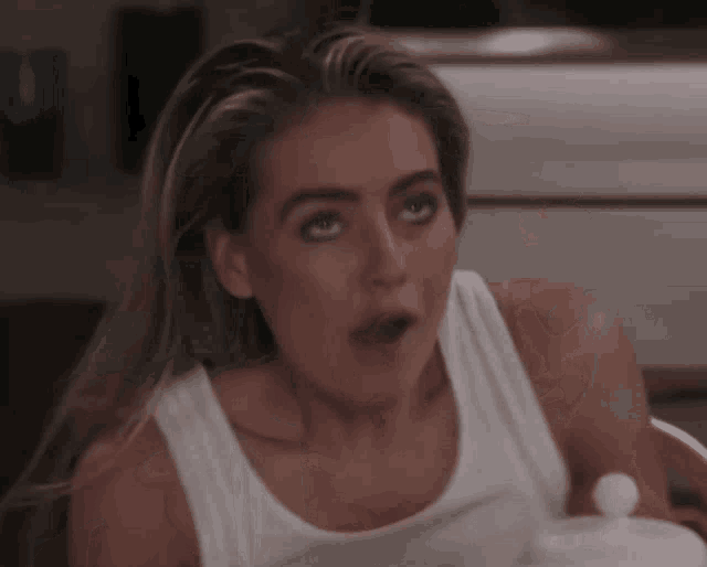 a woman with a surprised look on her face