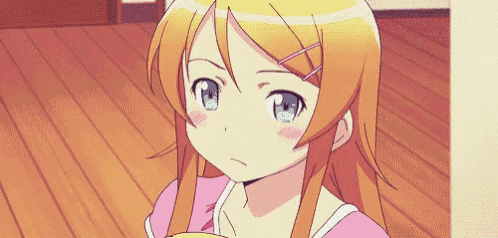 a girl with orange hair and blue eyes is standing on a wooden floor .