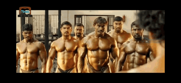 a group of bodybuilders standing next to each other in front of a mirror