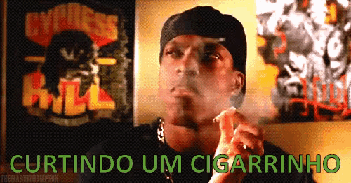 a man is smoking a cigar with the words curtindo um cigarrinho behind him