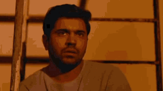 a man with a beard is thinking with a caption in malayalam