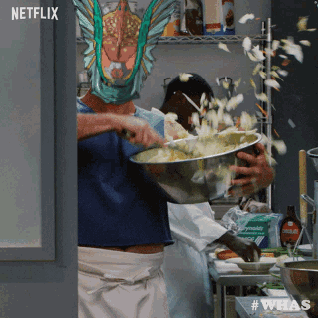 a man wearing a fish mask is mixing something in a bowl with netflix written on the bottom