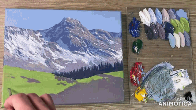 a painting of a mountain with a palette of paint next to it that says made in animonica