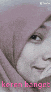 a close up of a woman 's face with the words " keren banget " on the bottom