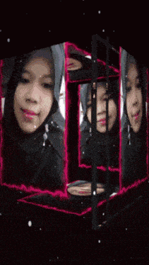 a woman wearing a black hijab and red lipstick is smiling