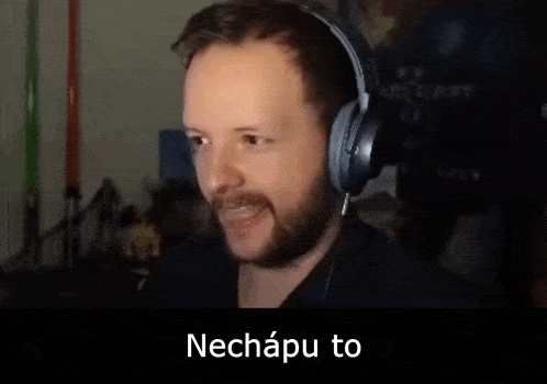 a man wearing headphones with a caption that says " to proste musíš mit uplene nasrano v hlave "