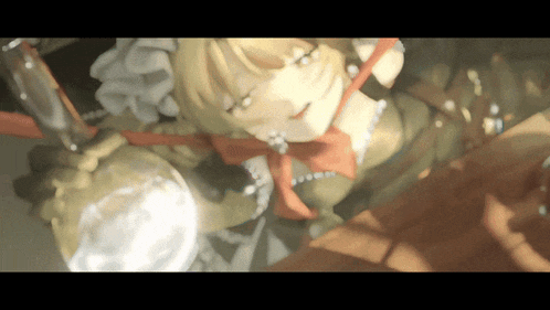 a close up of a doll with a red bow