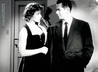 a man in a suit and tie stands next to a woman in a black dress in a black and white photo taken by cravello2023