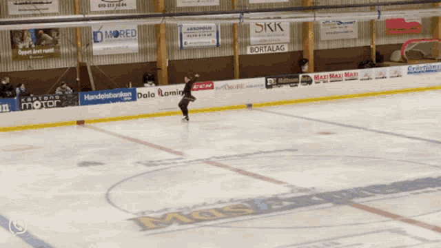 a hockey rink with a banner that says skk