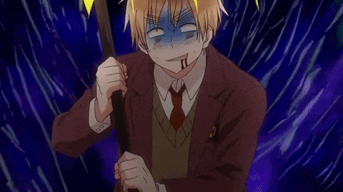 a man in a suit and tie is holding a stick in his hands and making a funny face .
