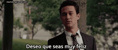 a man in a suit and tie is saying deseo que seas muy feliz in spanish