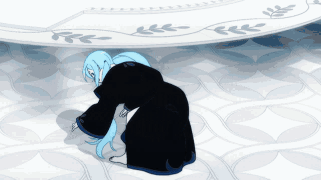 a person with blue hair is kneeling down in front of a white wall
