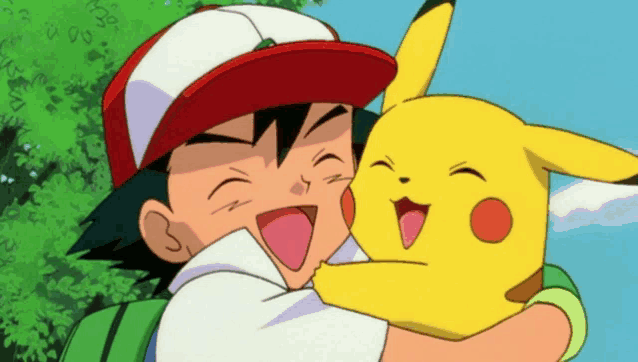 a boy in a red hat is holding a pikachu in his arms