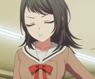 a girl in a school uniform with a red bow on her tie