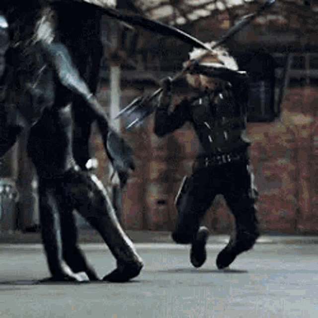 black widow is fighting a monster with a sword in a room .