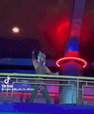 a woman in a star wars costume is standing on a balcony