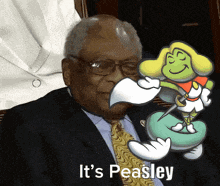 a man in a suit and tie is holding a cartoon frog and the words it 's peasley are above him