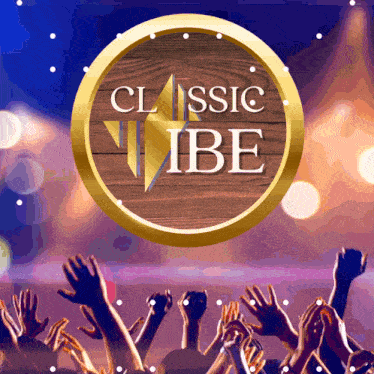 a crowd of people raising their hands in the air in front of a classic vibe sign