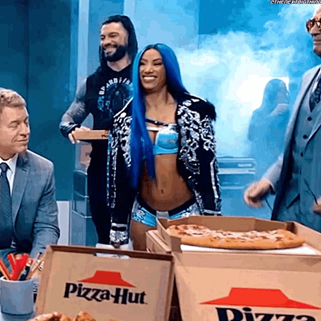 a pizza hut box with a pizza in it