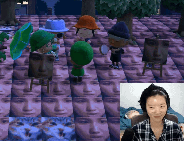 a woman in a plaid shirt is sitting in front of a video game screen