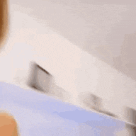 a woman is sticking her tongue out while smiling .