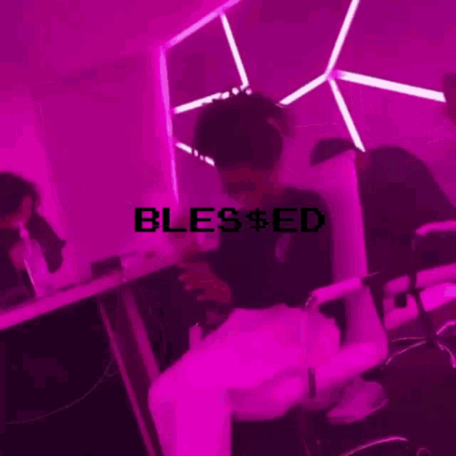 a person sitting in front of a purple wall with the word blessed written on it