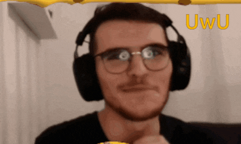 a man wearing headphones and glasses is looking at the camera with the letters uwu behind him