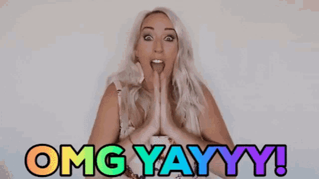 a woman with a surprised look on her face says omg yayyy !