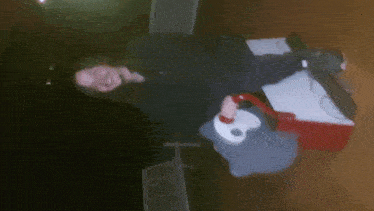 a blurred image of a person sitting on a table
