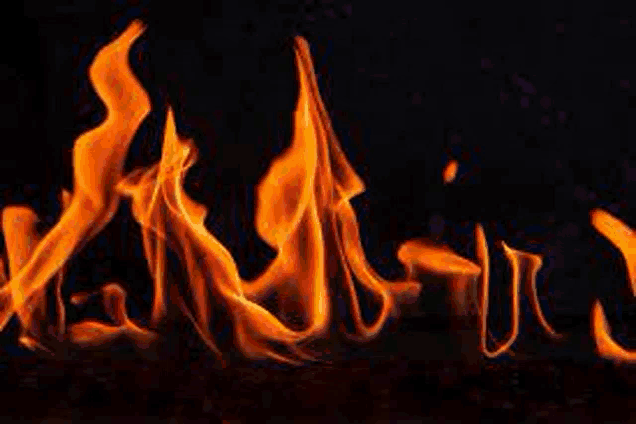 a close up of a fire on a black background