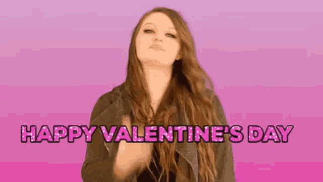a woman with long hair is saying happy valentine 's day .