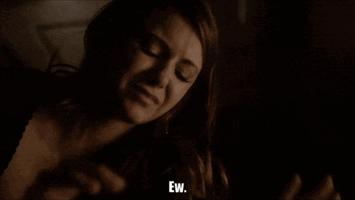 a close up of a woman 's face with the words ew visible