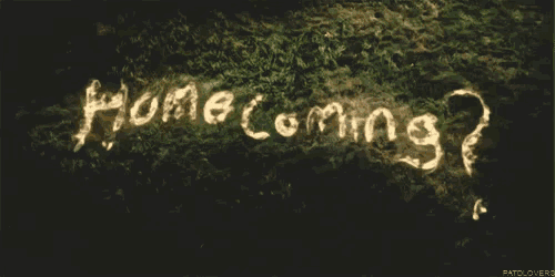 the word homecoming is written on a dark surface