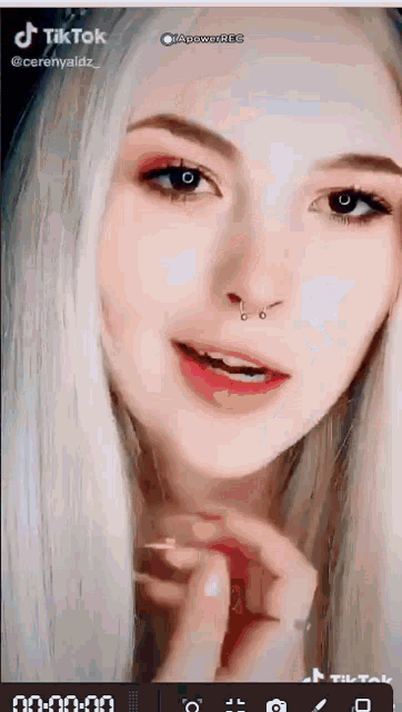 a close up of a woman 's face with a tiktok watermark on it