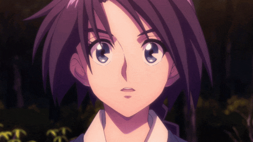a close up of a girl 's face with purple hair