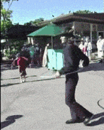 a man is walking with a sword in his hand