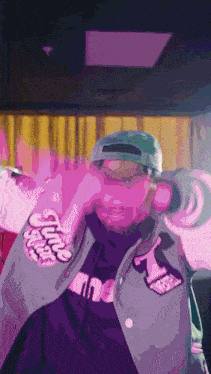 a man wearing a jacket that says ' supreme ' on the front