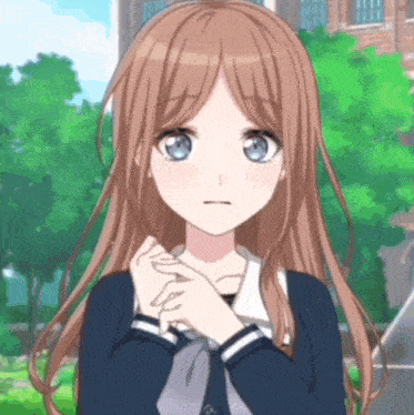 a girl with long brown hair and blue eyes has her hands on her chest
