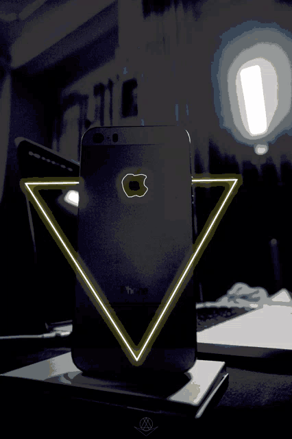 a black iphone with an apple logo on the back of it