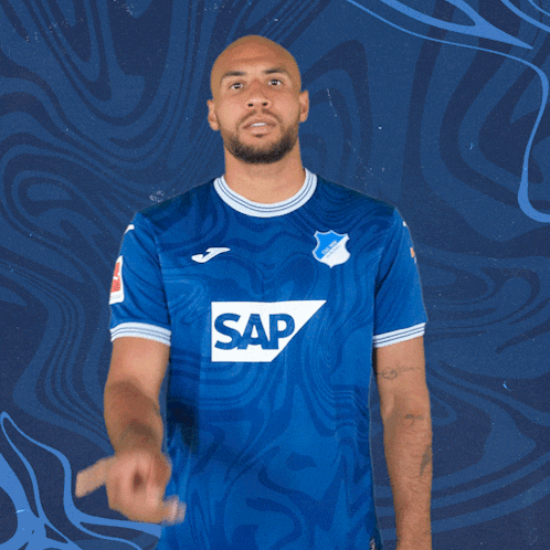 a man is wearing a blue shirt with the word sap on it