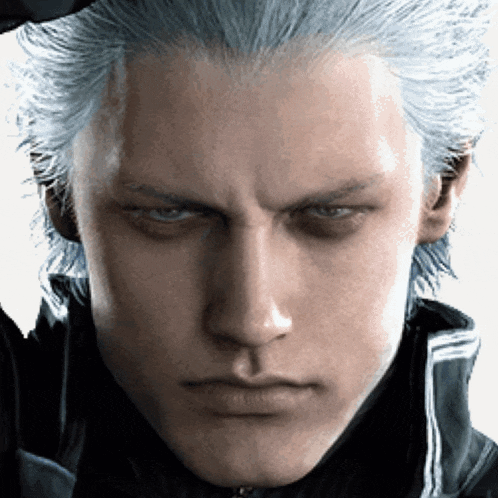 a close up of a man 's face with a serious expression