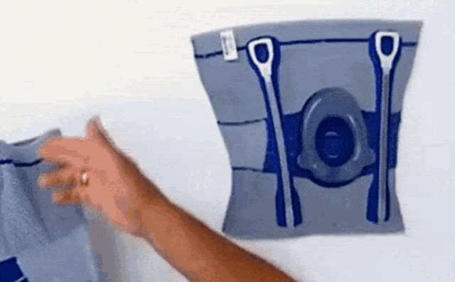 a person is holding a knee brace in their hand .