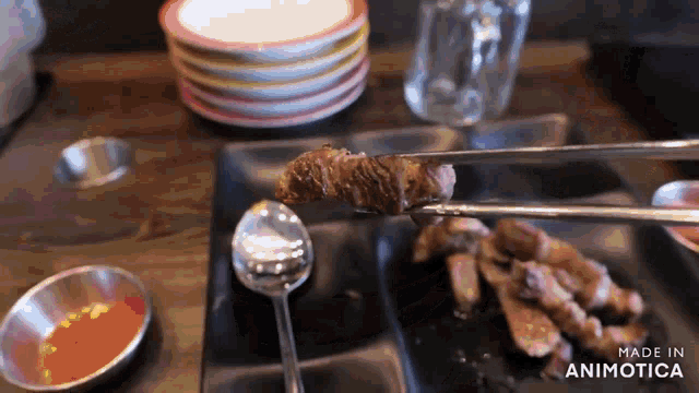 a close up of a plate of food with the words made in animotica on the bottom right