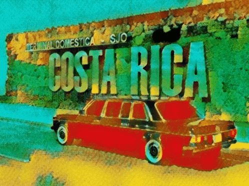 a red car is parked in front of a sign for costa rica
