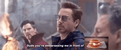 a man wearing glasses says dude you 're embarrassing me in front of a sandwich