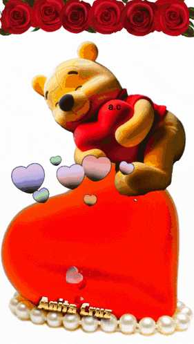 a winnie the pooh bear is laying on a red heart with hearts coming out of it